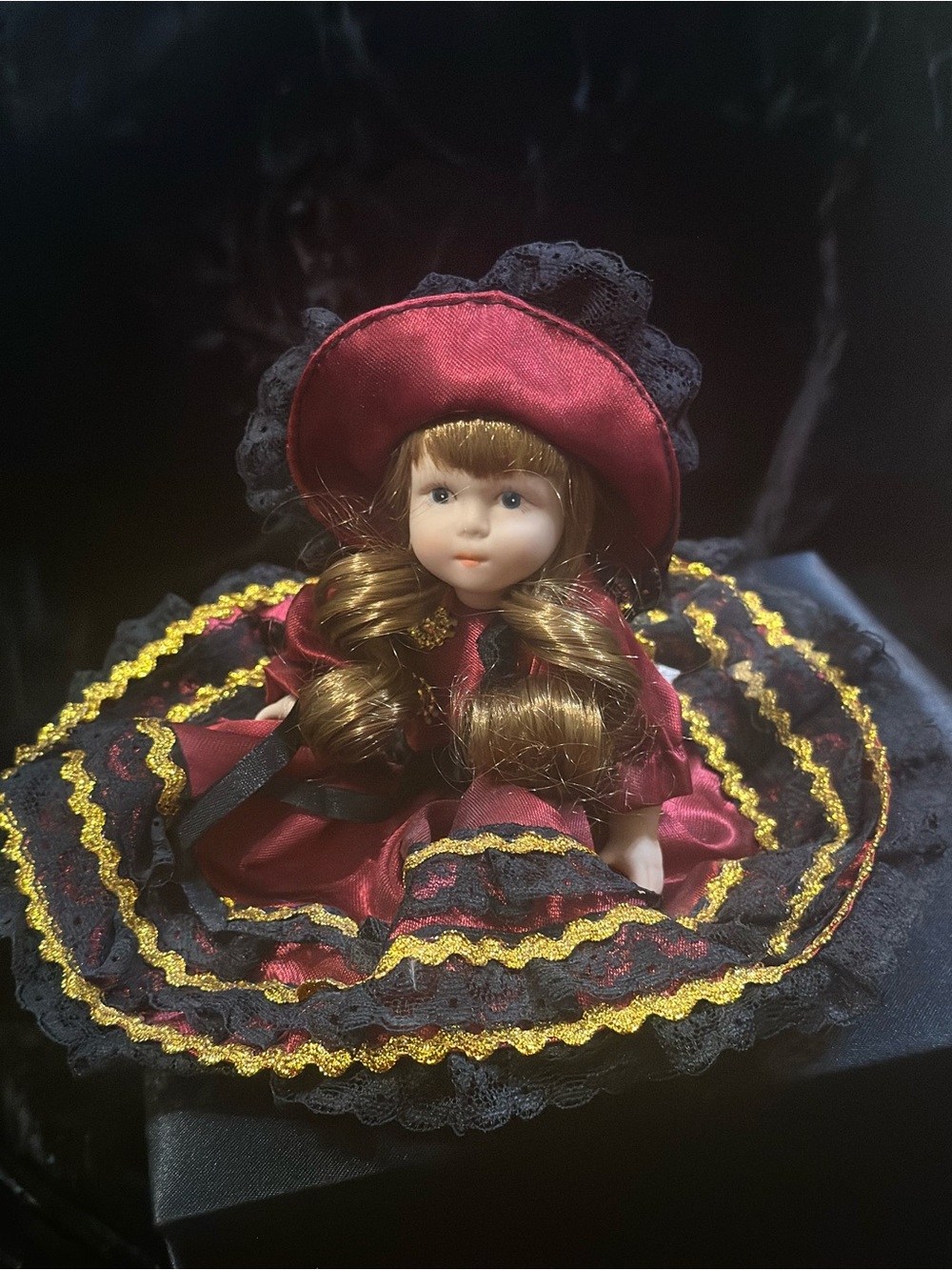 Porcelain Collectible Doll in Burgundy and Black - Picture 9 of 9